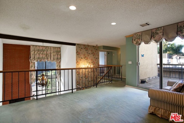 interior space featuring a textured ceiling