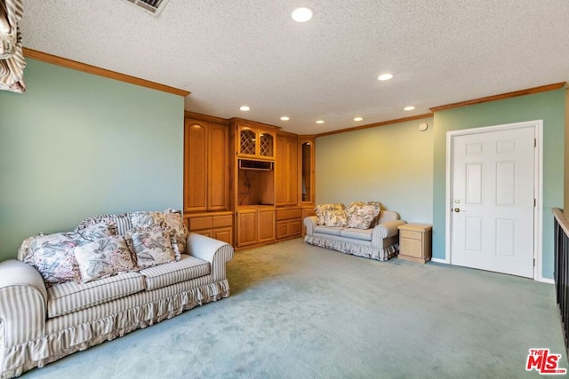 carpeted living room featuring a textured ceiling and crown molding