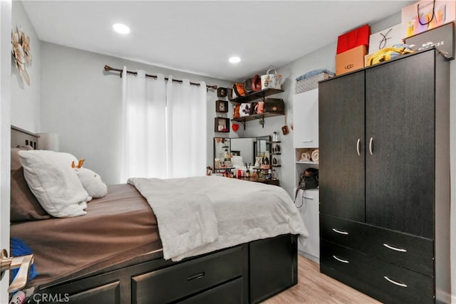 bedroom with light hardwood / wood-style flooring