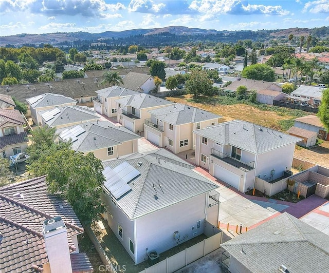 birds eye view of property with a mountain view