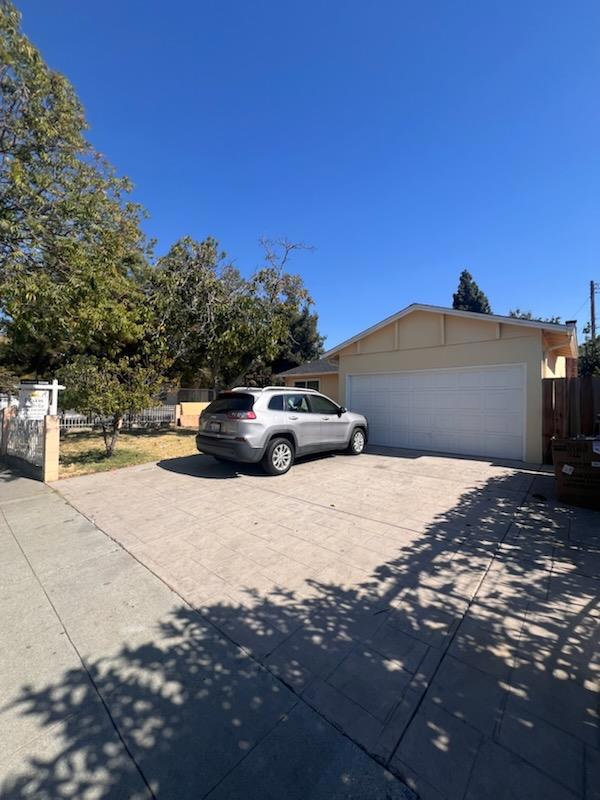 view of front of home featuring a garage and an outdoor structure