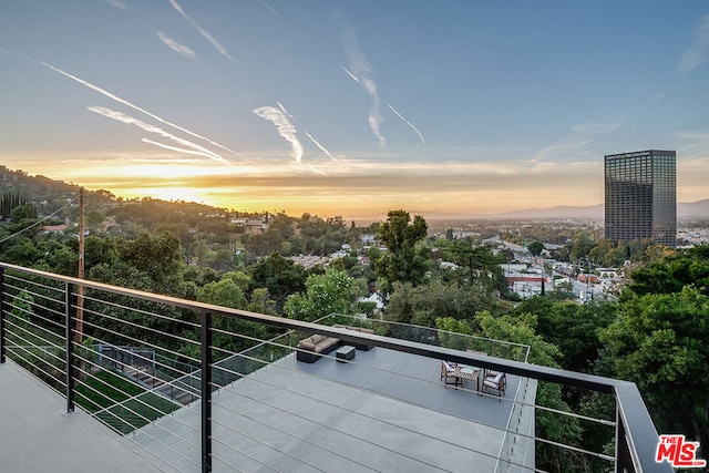 view of balcony at dusk