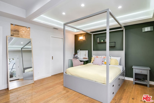 bedroom with light wood-type flooring