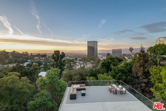 patio terrace at dusk with outdoor lounge area