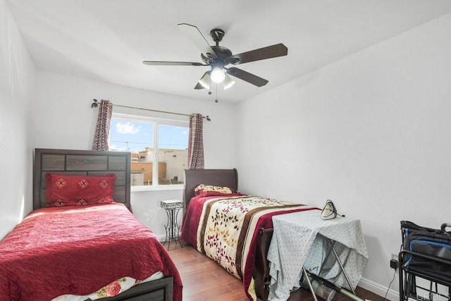 bedroom featuring ceiling fan and hardwood / wood-style floors