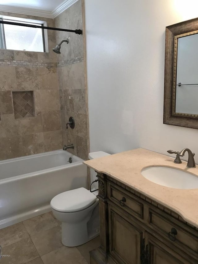 full bathroom featuring tiled shower / bath combo, tile patterned flooring, crown molding, toilet, and vanity