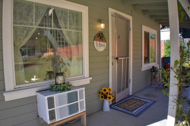 entrance to property featuring a porch