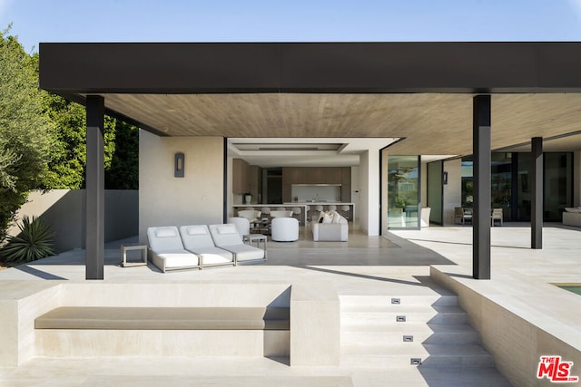 view of patio featuring an outdoor kitchen