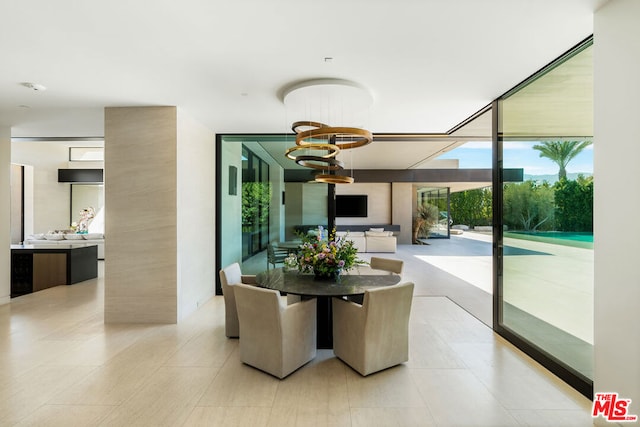 dining space featuring a wall of windows