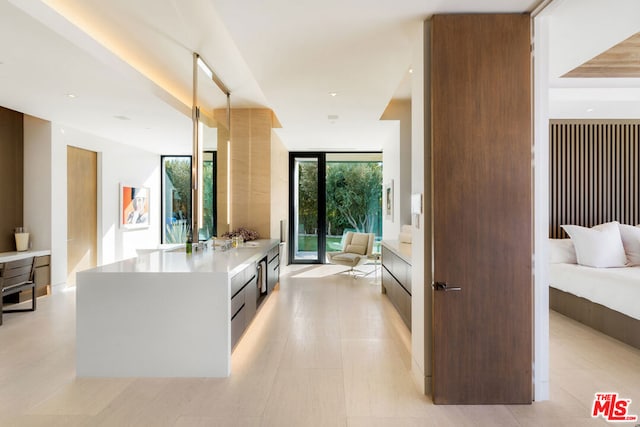 interior space with floor to ceiling windows and vanity