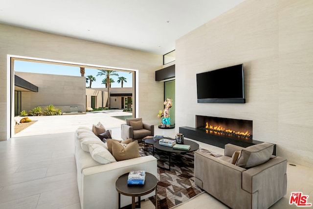 living room featuring a fireplace