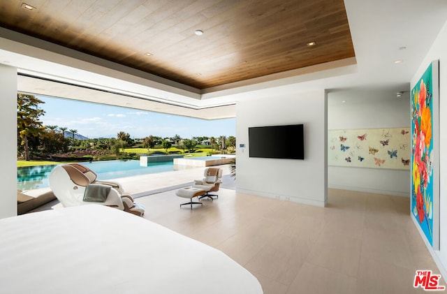 bedroom with a raised ceiling and wood ceiling