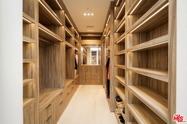 walk in closet featuring light hardwood / wood-style floors