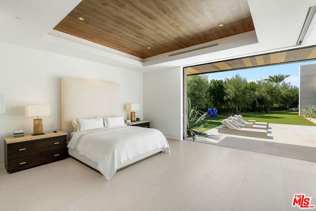 bedroom with a raised ceiling and wooden ceiling