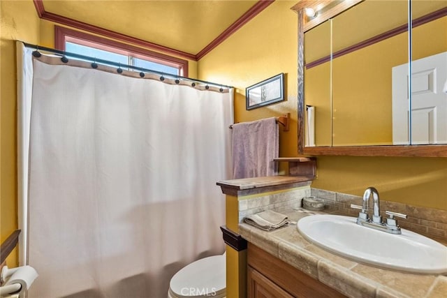 bathroom featuring toilet, vanity, crown molding, and a shower with shower curtain