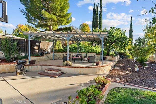 view of patio with a pergola and an outdoor living space with a fire pit