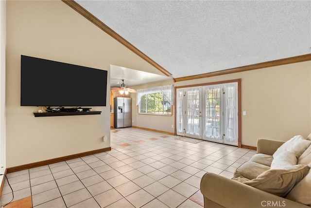 tiled living room featuring french doors, a textured ceiling, and high vaulted ceiling