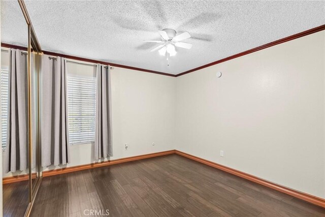 unfurnished room featuring crown molding, hardwood / wood-style floors, a textured ceiling, and ceiling fan