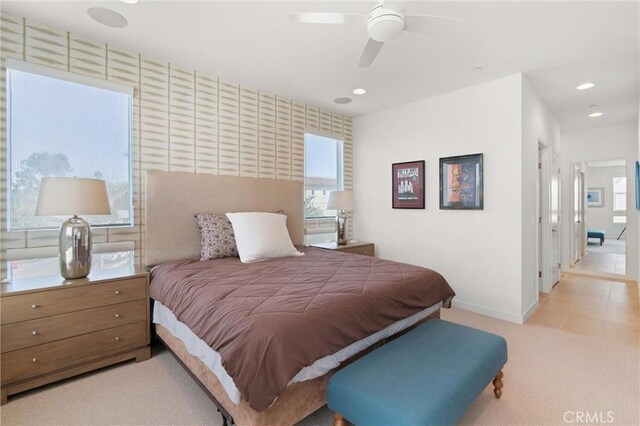 bedroom with light carpet and ceiling fan