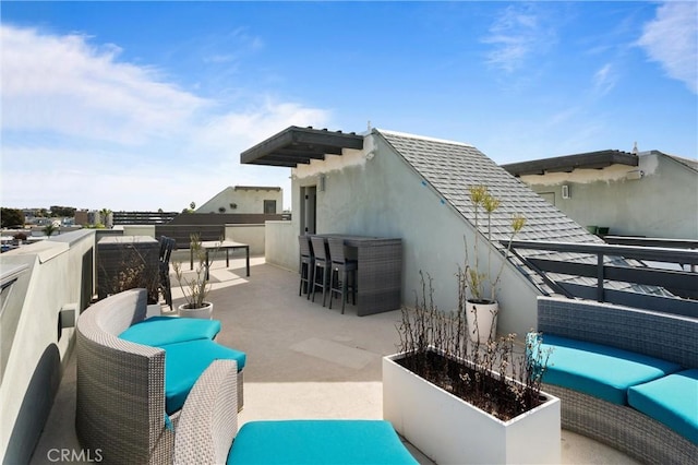 view of patio with an outdoor bar