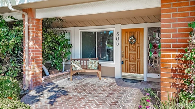 doorway to property featuring a porch