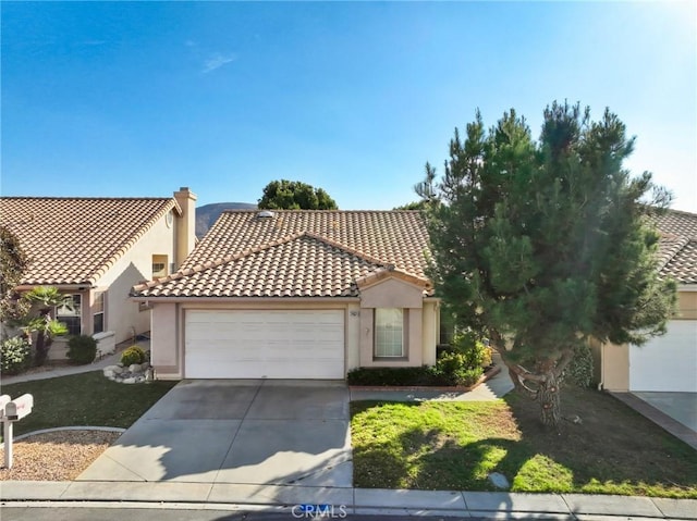 mediterranean / spanish-style house featuring a garage