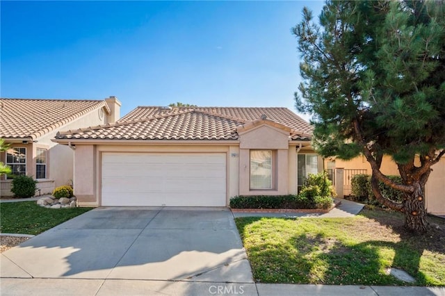 mediterranean / spanish-style home featuring a garage