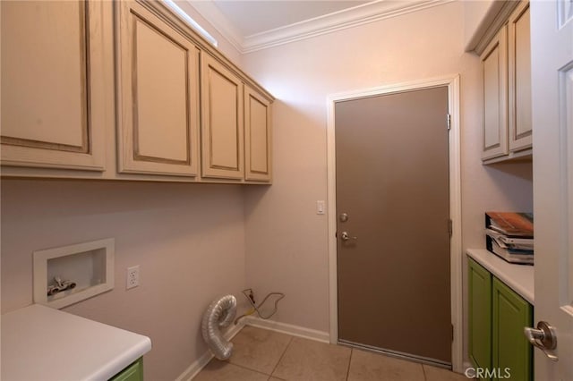 washroom featuring washer hookup, cabinets, ornamental molding, and light tile patterned floors