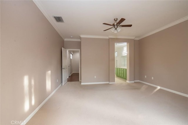 spare room featuring carpet flooring, ceiling fan, and ornamental molding