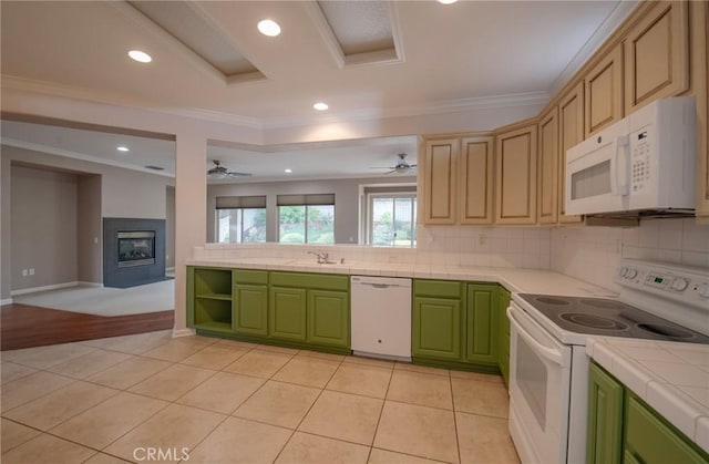 kitchen with tasteful backsplash, ornamental molding, white appliances, light tile patterned floors, and tile countertops