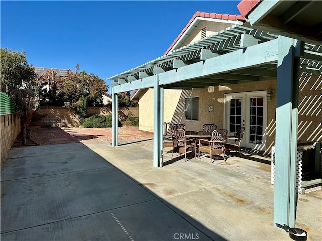 view of patio with a pergola and french doors