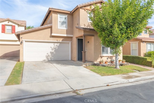 197 Lydia Ln, Corona, CA 92882 - townhome / multi-family property featuring stucco siding, a tile roof, and concrete driveway