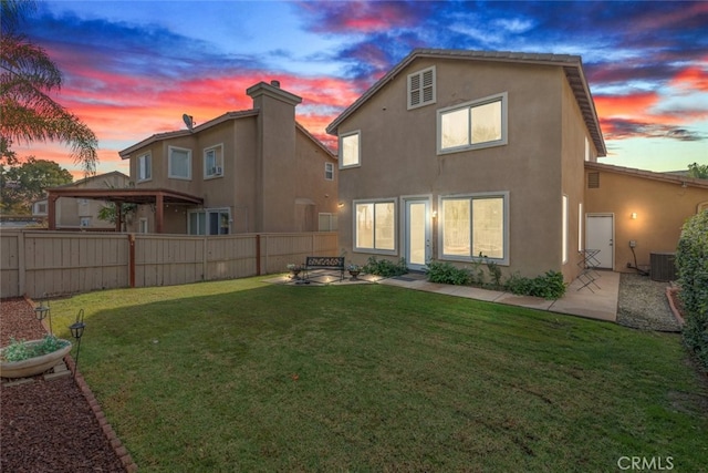 197 Lydia Ln, Corona, CA 92882 - rear view of house featuring central air condition unit, stucco siding, and a patio area