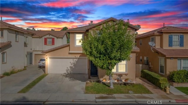197 Lydia Ln, Corona, CA 92882 - view of front of property with a garage, driveway, stucco siding, and a tile roof