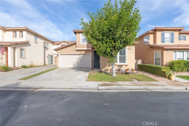 197 Lydia Ln, Corona, CA 92882 - view of front of property featuring stucco siding, concrete driveway, a garage, and a tile roof