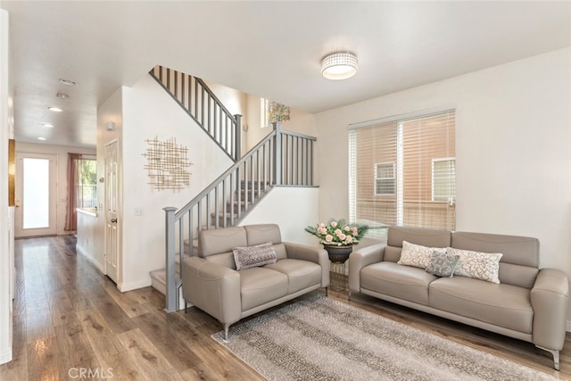 197 Lydia Ln, Corona, CA 92882 - living room featuring stairway, wood finished floors, baseboards, and recessed lighting