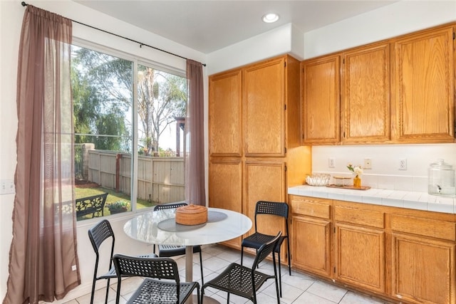 interior space with a healthy amount of sunlight and light tile patterned floors