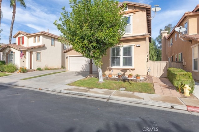 197 Lydia Ln, Corona, CA 92882 - view of front of home with driveway, stucco siding, fence, and a garage