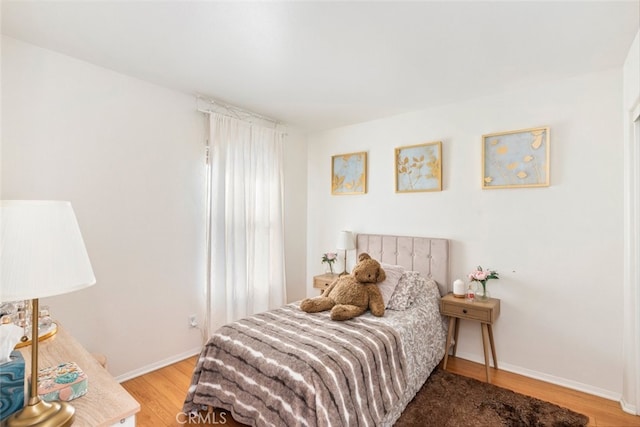 bedroom with hardwood / wood-style floors