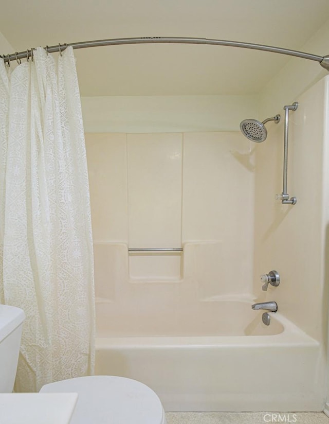 bathroom with toilet and shower / tub combo with curtain