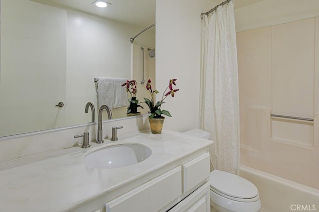 full bathroom featuring vanity, toilet, and shower / tub combo