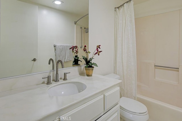 bathroom with toilet, shower / tub combo, and vanity
