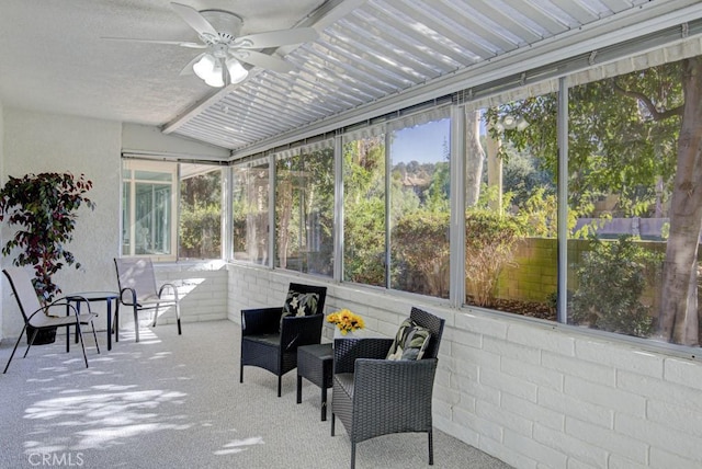 sunroom featuring ceiling fan and lofted ceiling