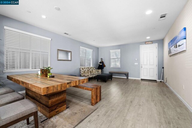 dining space with light hardwood / wood-style floors