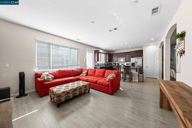 living room with light hardwood / wood-style floors