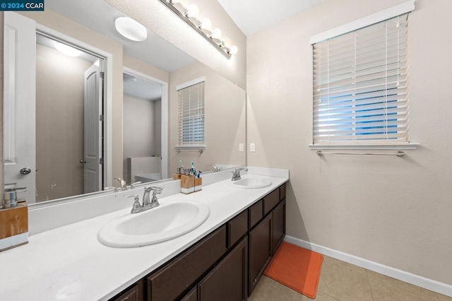 bathroom featuring tile patterned flooring and vanity