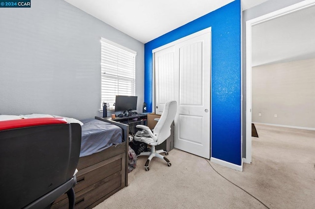 bedroom featuring light colored carpet