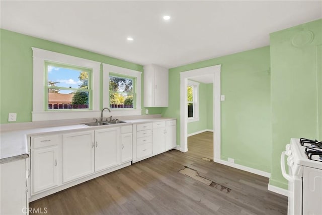 1312 4th, Corning, CA 96021 - kitchen with gas range gas stove, white cabinetry, healthy amount of natural light, light countertops, and recessed lighting