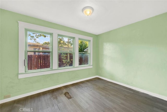 1312 4th, Corning, CA 96021 - unfurnished room with healthy amount of natural light and wood finished floors