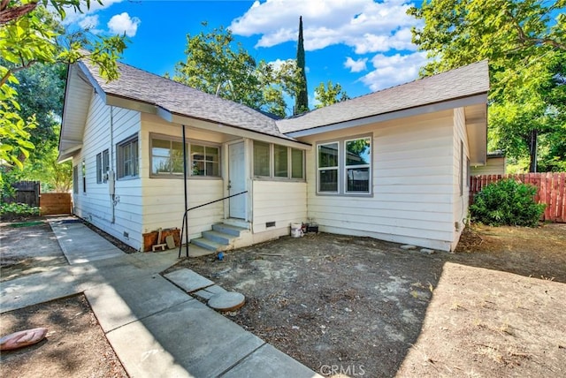 1312 4th, Corning, CA 96021 - view of front of home featuring entry steps, a patio, crawl space, and a shingled roof